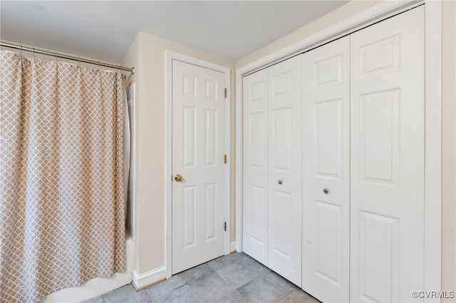 3167 Trenholm Rd, Powhatan, VA 23139 - bathroom featuring a closet and shower / bath combination with curtain