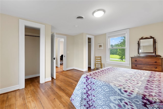 3167 Trenholm Rd, Powhatan, VA 23139 - bedroom featuring two closets and light wood-type flooring
