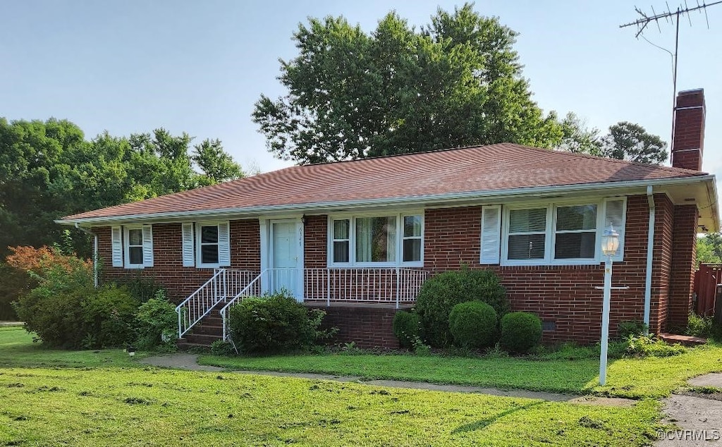 8819 Michaux Ln, Henrico, VA 23229 - ranch-style home featuring a chimney, a front yard, and brick siding