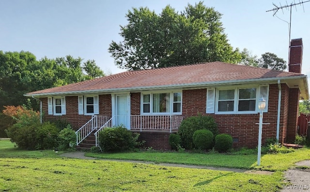 8819 Michaux Ln, Henrico, VA 23229 - ranch-style home featuring a chimney, a front yard, and brick siding