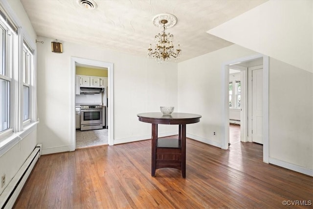1415 New Market Rd 1411, Henrico, VA 23231 - unfurnished dining area with baseboard heating, a chandelier, and wood finished floors