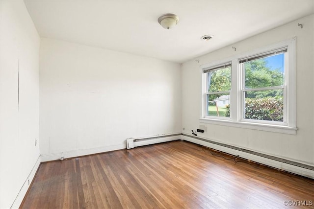 1415 New Market Rd 1411, Henrico, VA 23231 - empty room featuring wood finished floors, a baseboard radiator, and baseboard heating