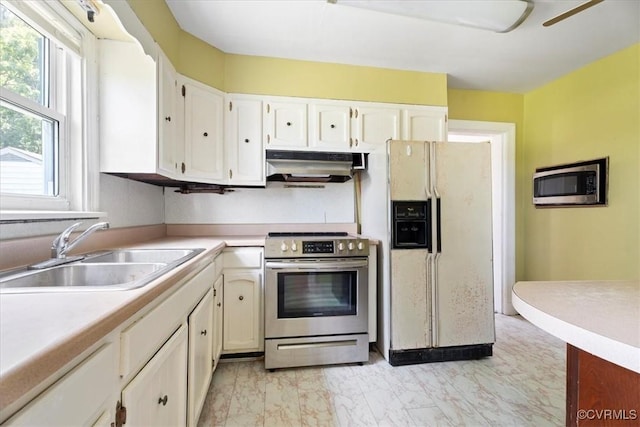 1415 New Market Rd 1411, Henrico, VA 23231 - kitchen with stainless steel appliances, under cabinet range hood, light marble finish floors, and plenty of natural light