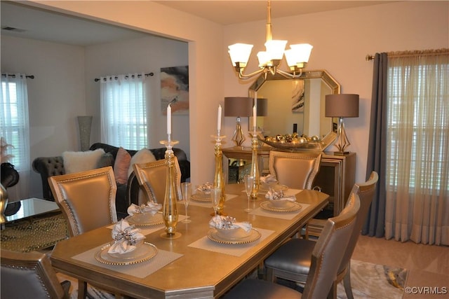 4331 Ganymede Dr, Chester, VA 23831 - carpeted dining space featuring a chandelier
