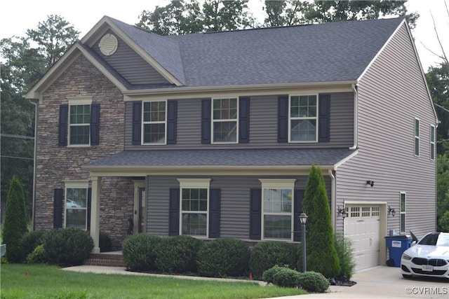 4331 Ganymede Dr, Chester, VA 23831 - view of front of house featuring concrete driveway, a garage, stone siding, and a shingled roof