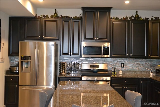 4331 Ganymede Dr, Chester, VA 23831 - kitchen featuring appliances with stainless steel finishes, backsplash, and dark stone counters
