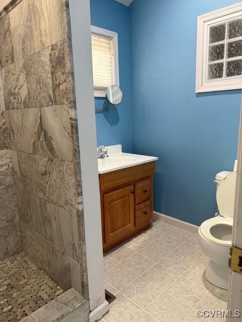 4002 Crystalwood Ln, Henrico, VA 23294 - bathroom featuring a tile shower, tile patterned flooring, and vanity