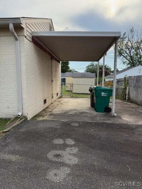 4002 Crystalwood Ln, Henrico, VA 23294 - view of vehicle parking featuring a carport and asphalt driveway