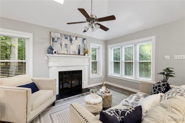 14408 Woods Walk Ct, Midlothian, VA 23112 - living area with healthy amount of natural light, ceiling fan, a fireplace with flush hearth, wood finished floors, and lofted ceiling