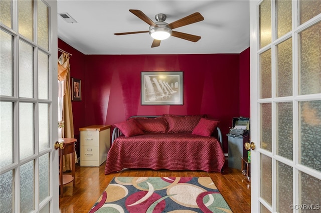 4055 Tanner Slip Cir, Chester, VA 23831 - bedroom with wood finished floors and ceiling fan