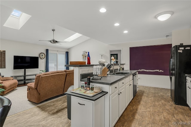 4055 Tanner Slip Cir, Chester, VA 23831 - kitchen with a skylight, open floor plan, dark countertops, freestanding refrigerator, and recessed lighting