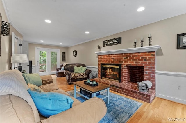 6003 Lansgate Rd, Midlothian, VA 23112 - living room featuring crown molding, wood finished floors, wainscoting, a fireplace, and recessed lighting