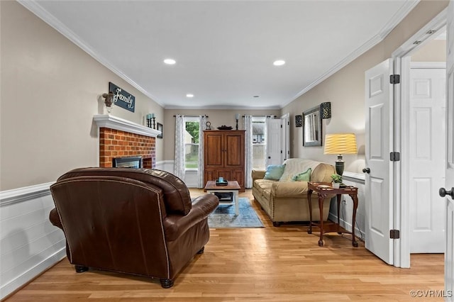 6003 Lansgate Rd, Midlothian, VA 23112 - living area with light wood-type flooring, ornamental molding, a brick fireplace, recessed lighting, and a wainscoted wall