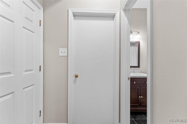 6003 Lansgate Rd, Midlothian, VA 23112 - hallway with tile patterned floors and a sink