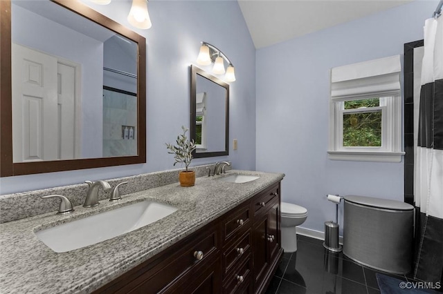 6003 Lansgate Rd, Midlothian, VA 23112 - bathroom featuring double vanity, tile patterned floors, vaulted ceiling, and a shower with curtain