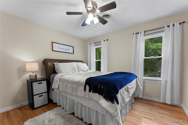 6003 Lansgate Rd, Midlothian, VA 23112 - bedroom featuring light wood-style floors, multiple windows, and a ceiling fan