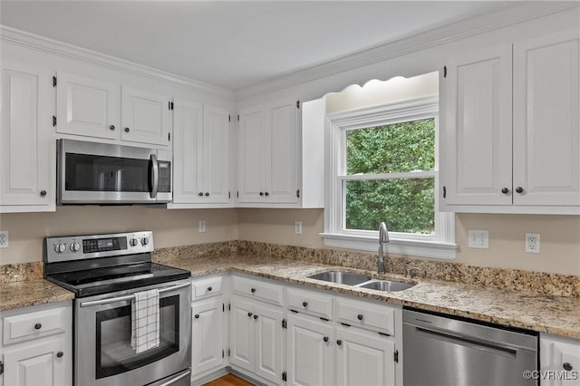 6003 Lansgate Rd, Midlothian, VA 23112 - kitchen featuring appliances with stainless steel finishes, white cabinetry, light stone countertops, and crown molding