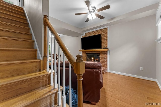 6003 Lansgate Rd, Midlothian, VA 23112 - stairs with a brick fireplace, ceiling fan, and wood finished floors