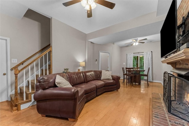 6003 Lansgate Rd, Midlothian, VA 23112 - living area with a ceiling fan, a brick fireplace, and light wood-style floors