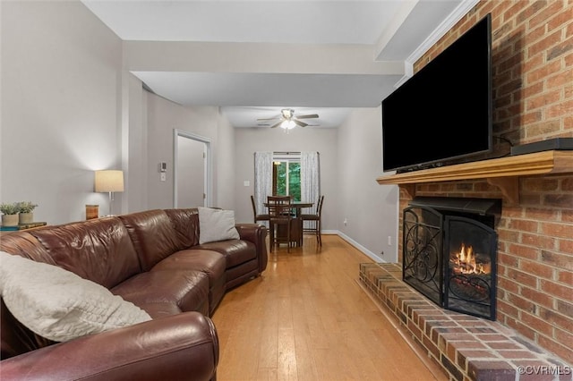 6003 Lansgate Rd, Midlothian, VA 23112 - living area with light wood-style flooring, a fireplace, and a ceiling fan