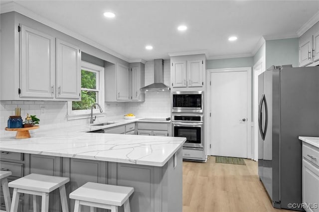13219 Lauren Ln, Midlothian, VA 23114 - kitchen with stainless steel appliances, ornamental molding, a peninsula, decorative backsplash, and wall chimney exhaust hood