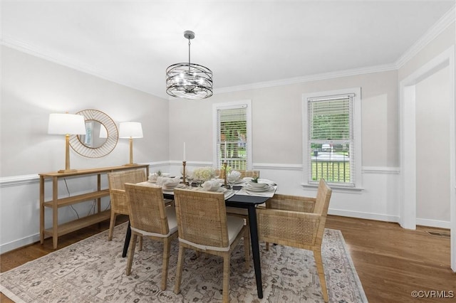 13219 Lauren Ln, Midlothian, VA 23114 - dining area with wood finished floors, a chandelier, and ornamental molding