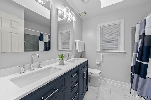 13219 Lauren Ln, Midlothian, VA 23114 - bathroom featuring double vanity, a skylight, and a shower with shower curtain