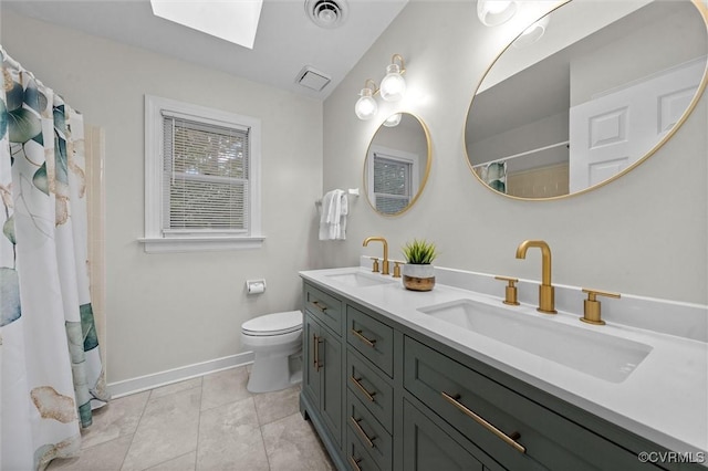 13219 Lauren Ln, Midlothian, VA 23114 - bathroom with a skylight, double vanity, and a shower with curtain