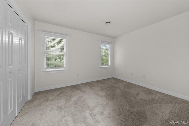 13219 Lauren Ln, Midlothian, VA 23114 - unfurnished bedroom featuring carpet floors, multiple windows, and a closet