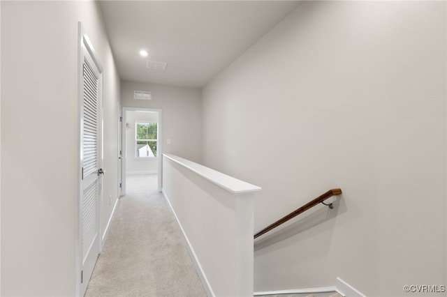1665 Ewing Park Loop, Midlothian, VA 23113 - hall with an upstairs landing, light colored carpet, and recessed lighting