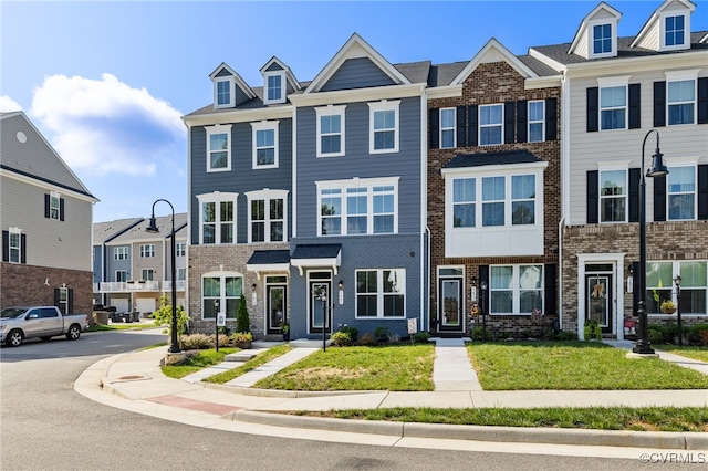 1665 Ewing Park Loop, Midlothian, VA 23113 - view of front facade with brick siding, a front lawn, and a residential view