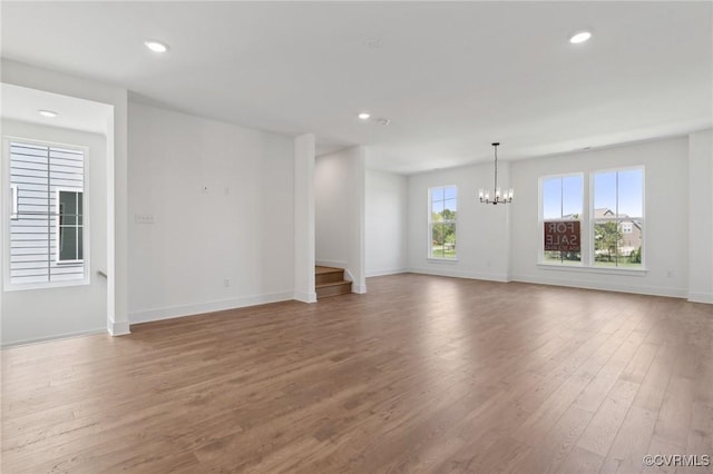 12149 Morning Walk, Henrico, VA 23233 - unfurnished living room featuring a chandelier, wood finished floors, recessed lighting, and stairs