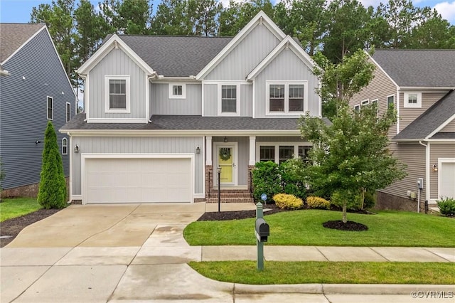 18007 Twin Falls Ln, Moseley, VA 23120 - view of front of house featuring a shingled roof, concrete driveway, a front yard, an attached garage, and board and batten siding