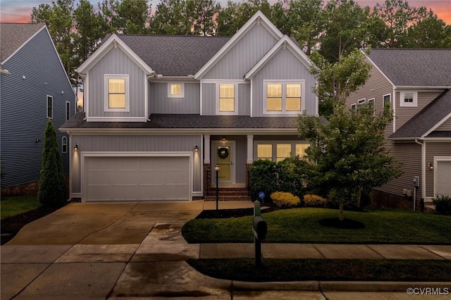 18007 Twin Falls Ln, Moseley, VA 23120 - view of front of property with a shingled roof, driveway, an attached garage, and a front yard