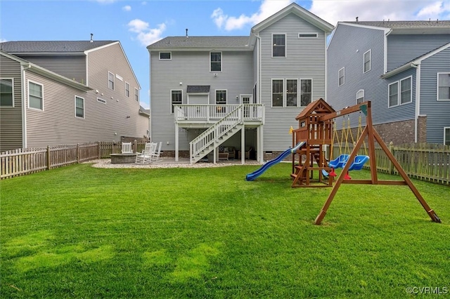 18007 Twin Falls Ln, Moseley, VA 23120 - back of property with a fenced backyard, a playground, a fire pit, and a patio