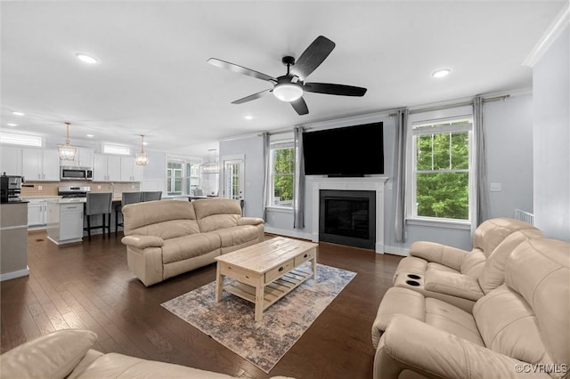 18007 Twin Falls Ln, Moseley, VA 23120 - living room featuring healthy amount of natural light, recessed lighting, crown molding, ceiling fan, and dark wood-style floors