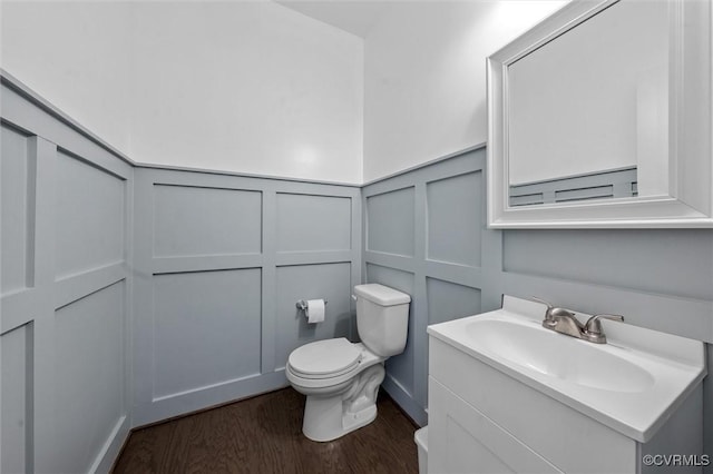 18007 Twin Falls Ln, Moseley, VA 23120 - bathroom with a decorative wall, vanity, wood finished floors, and a wainscoted wall