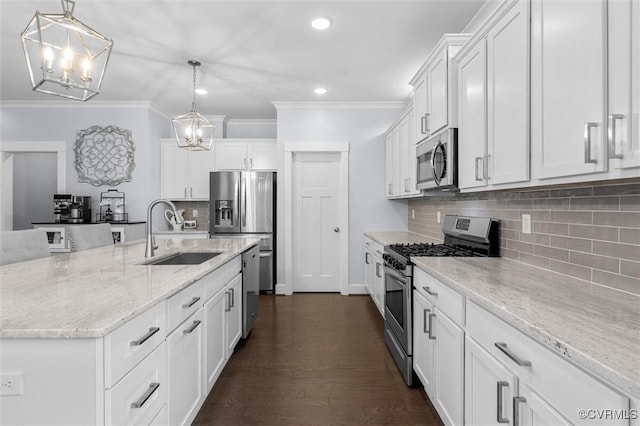 18007 Twin Falls Ln, Moseley, VA 23120 - kitchen featuring stainless steel appliances, white cabinets, crown molding, backsplash, and a chandelier