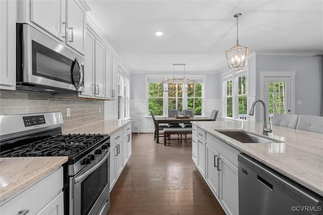 18007 Twin Falls Ln, Moseley, VA 23120 - kitchen featuring appliances with stainless steel finishes, dark wood finished floors, decorative backsplash, a chandelier, and white cabinetry