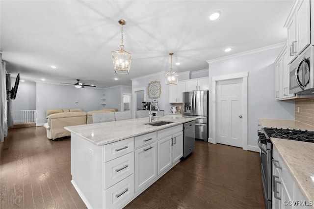 18007 Twin Falls Ln, Moseley, VA 23120 - kitchen featuring stainless steel appliances, recessed lighting, white cabinets, open floor plan, and a kitchen island with sink