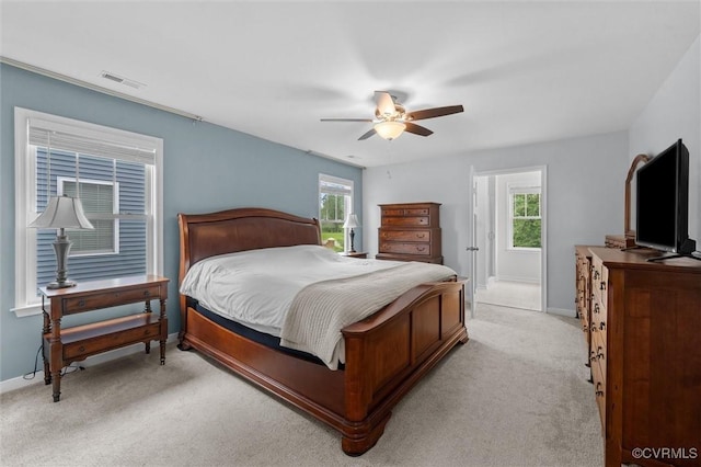 18007 Twin Falls Ln, Moseley, VA 23120 - bedroom featuring light carpet, multiple windows, and a ceiling fan
