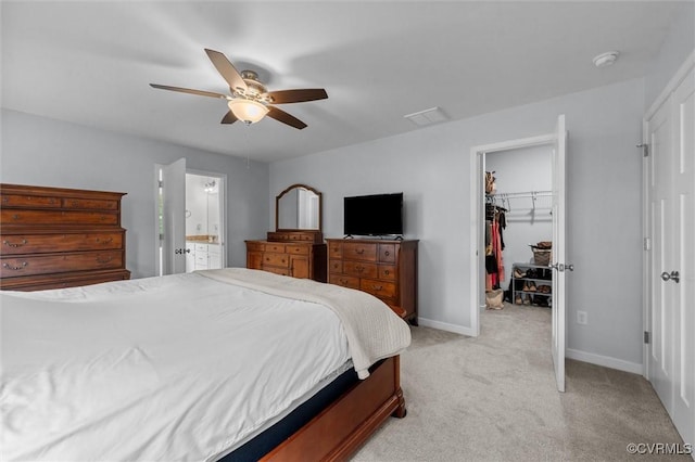 18007 Twin Falls Ln, Moseley, VA 23120 - bedroom with light colored carpet, a walk in closet, a ceiling fan, and connected bathroom