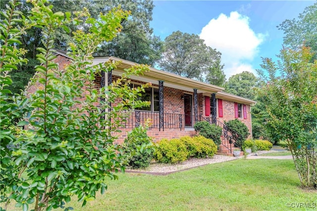 1020 Challis Ln, Sandston, VA 23150 - single story home with brick siding, a front lawn, and a porch