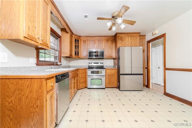 1020 Challis Ln, Sandston, VA 23150 - kitchen featuring appliances with stainless steel finishes, light floors, light countertops, and glass insert cabinets