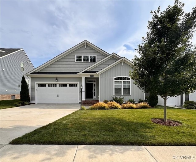 16813 Laurel Park Dr, Moseley, VA 23120 - craftsman house featuring a garage, driveway, a front lawn, and board and batten siding