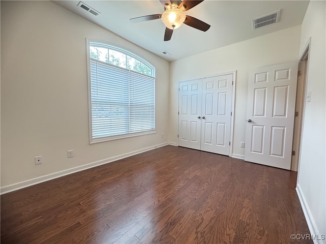 16813 Laurel Park Dr, Moseley, VA 23120 - unfurnished bedroom with dark wood-type flooring, a closet, and a ceiling fan