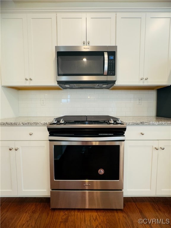 16813 Laurel Park Dr, Moseley, VA 23120 - kitchen with stainless steel appliances, dark wood-style flooring, light stone countertops, and decorative backsplash