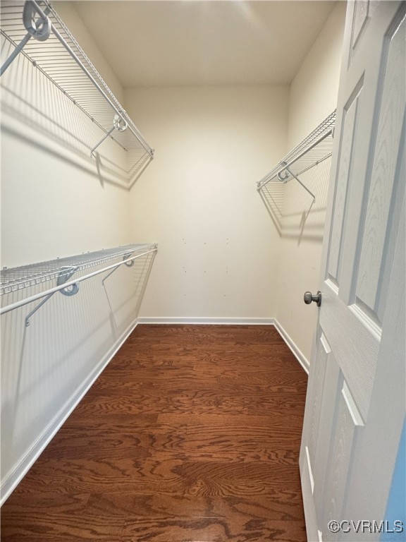 16813 Laurel Park Dr, Moseley, VA 23120 - walk in closet featuring dark wood-type flooring