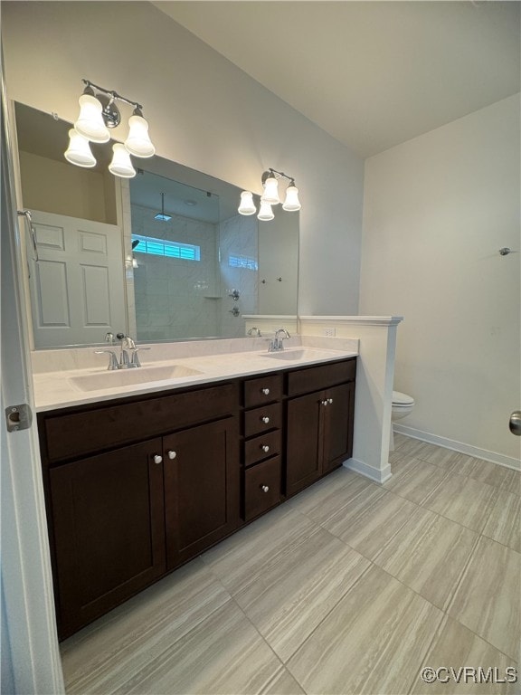 16813 Laurel Park Dr, Moseley, VA 23120 - full bathroom with double vanity, a tile shower, a chandelier, and tile patterned floors
