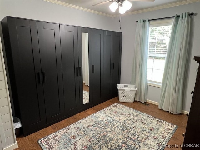 102 Mechams Cove Rd, Topping, VA 23169 - bedroom featuring wood finished floors, ornamental molding, and a ceiling fan
